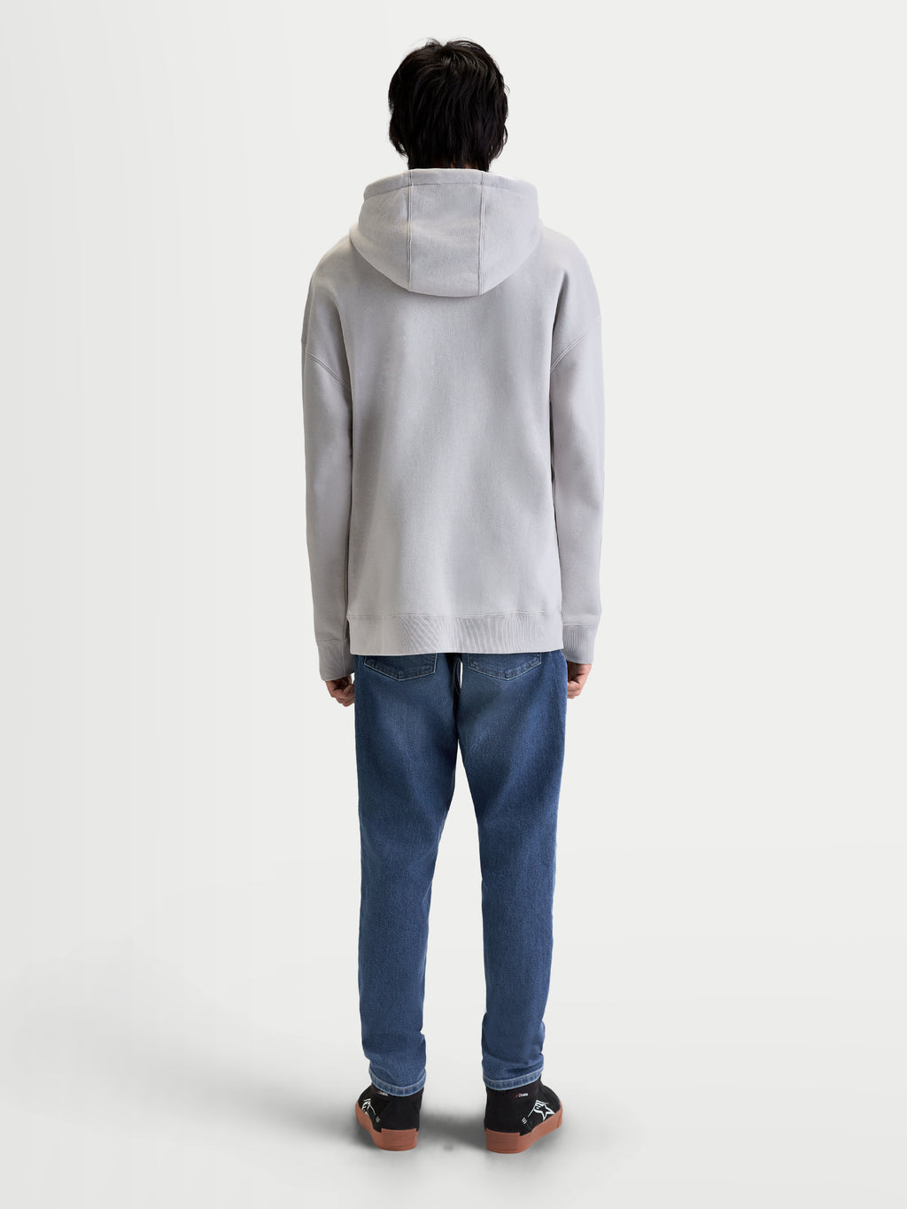 Alpinestars Prelude Oversized hættetrøje, grå sportswear fleece-pullover til herrer, set bagfra på model med afslappet pasform, selvforet hætte og ribmanchetter og ribkant.
