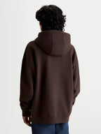 Alpinestars Prelude Oversized Hættetrøje, brun fleecepullover set bagfra med en afslappet silhuet, selvforet hætte, ribmanchetter og ribkant, premium hverdagsbeklædning og sportstøj.
