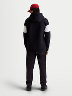 Alpinestars Cubic hættetrøje, unisex sportswear-hættetrøje i fleece, sort og hvid med farveblokerede ærmer, set bagfra på model, premium bomuldsblanding, afslappet hverdagstøj til brug væk fra motorcyklen.