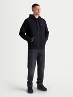 Alpinestars Pioneer Oversized Hættetrøje, sort hættetrøje med lynlås i fleece til herre og dame, afslappet oversized pasform, Vislon-lynlås, kængurulomme med 'ONE GOAL. ONE VISION.' tekst og hvidt Astars-logo på brystet, bomuldsblanding til hverdagsbrug.