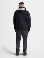 Alpinestars Pioneer Oversized Hættetrøje, sort fleecehættetrøje set bagfra med hvidt Astars-broderi på hætten, oversized pasform, afslappet motorsport sportswear til hverdag.