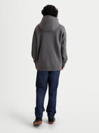 Alpinestars Entity Oversized Hoodie, Sportswear Zip-Up Fleece, Unisex, Charcoal Gray, Back View on Model showing Relaxed Fit, Self-Lined Hood, and Ribbed Cuffs, Cotton and Recycled Polyester Blend