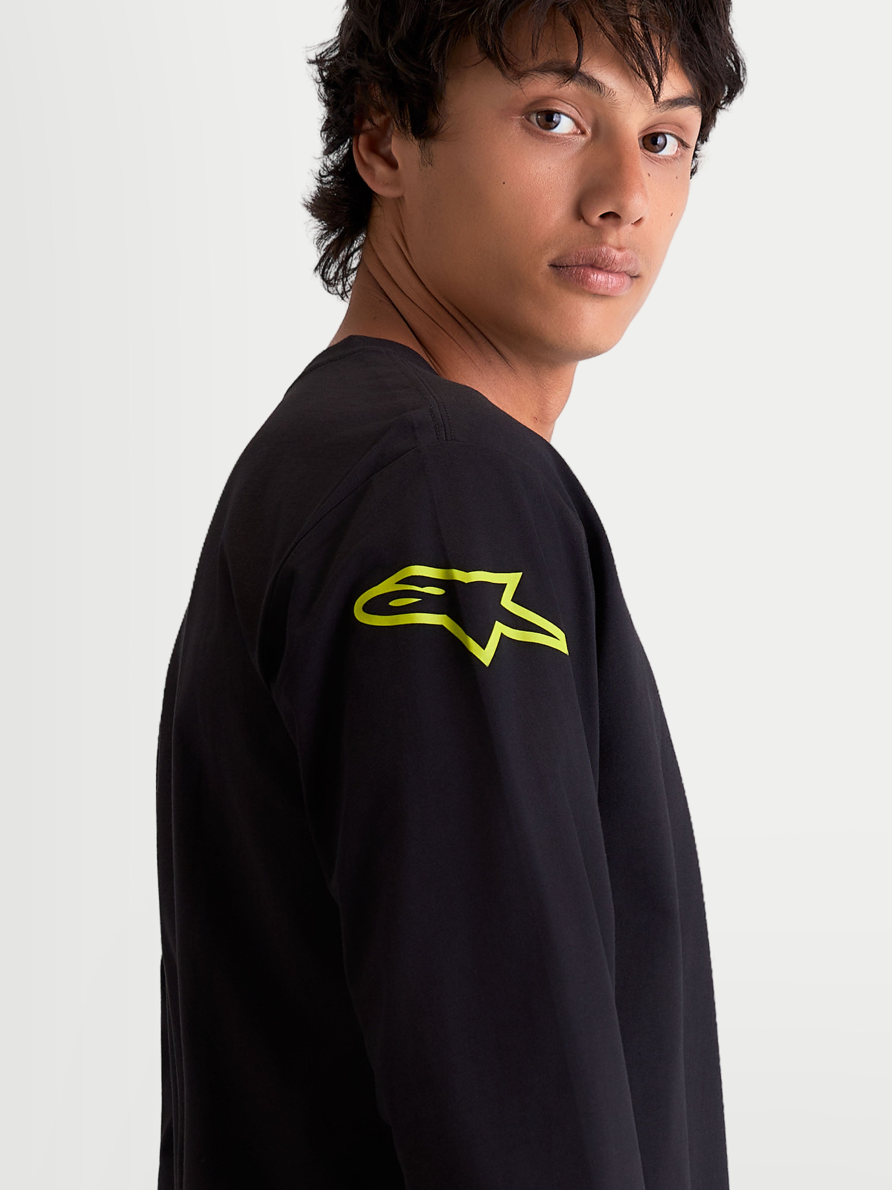 Alpinestars Velocifier CSF Tee, Men's Long Sleeve Sportswear T-Shirt, Black with a Vibrant Yellow Astars Logo on the Shoulder, Close-up View, Motorsport-Inspired Casual Wear.