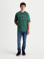 Alpinestars Infinity Oversized CSF T-shirt, grøn kortærmet sportswear T-shirt til mænd og kvinder, med hvid Alpinestars Inc grafik på brystet og logo på ærmet, oversized pasform, premium bomulds-polyesterblanding
