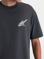 Alpinestars Ghost Oversized CSF Tee, Short Sleeve Sportswear T-shirt, Charcoal Gray, featuring a light-colored Astars logo graphic on the chest, close-up view on-model, relaxed fit cotton-poly blend for everyday casual wear.