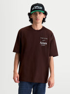 Alpinestars Post Oversized CSF T-shirt, herre-t-shirt i brun, kortærmet sportswear med oversized fit, hvidt Astars logo og One Goal. One Vision. grafik på brystet, afslappet motorsport livsstilstøj