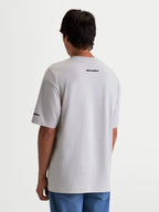 Alpinestars Mandate Oversized CSF T-shirt, kortærmet herre-T-shirt set bagfra, cementgrå, afslappet oversized pasform med Alpinestars-ordmærke på skulder og ærme, moderne sportswear.