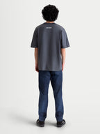 Alpinestars Mandate Oversized CSF T-shirt, kortærmet sportswear t-shirt, unisex, grå, bomulds-polyesterblanding, set bagfra på model med hvid Alpinestars-grafik og afslappet oversized pasform.