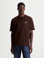 Alpinestars Mandate Oversized CSF Tee, Short Sleeve Casual Sportswear T-Shirt, Brown, featuring a white puff-print Astars chest logo and sleeve graphic, relaxed oversized fit, premium cotton-poly blend.