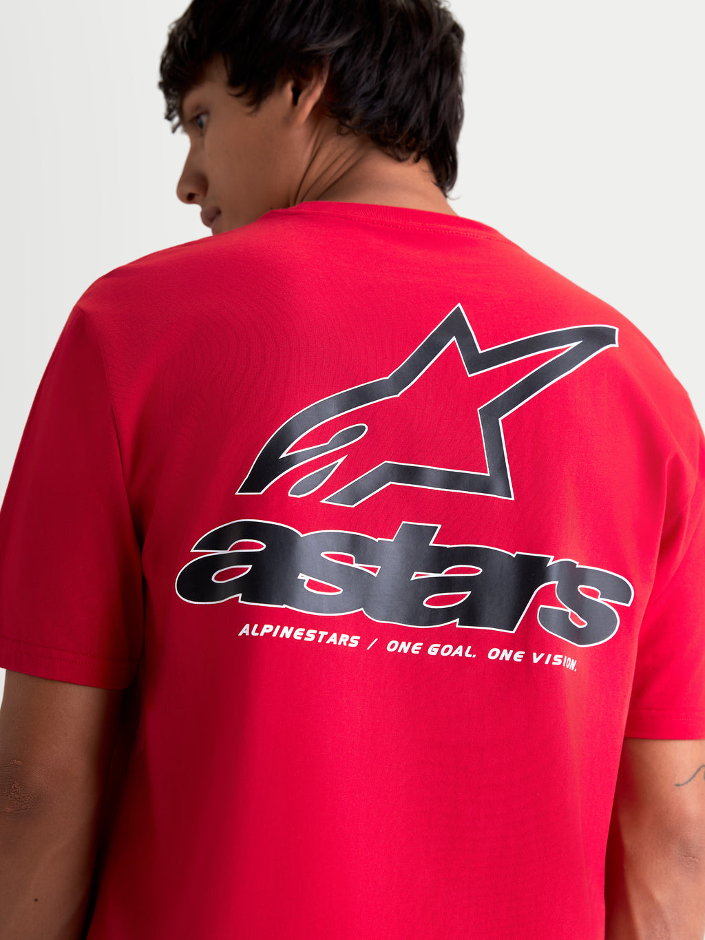 Alpinestars Lineout CSF T-shirt, rød kortærmet t-shirt til mænd set bagfra med stort sort og hvidt Astars-logo og 'One Goal. One Vision.' tagline, blød printfinish, afslappet motorsport sportswear.