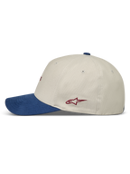 Alpinestars County Canvas kasket, sportswearkasket i sand og blå med buet skygge og rødt logo, set fra siden.