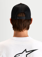 Alpinestars Thicket Realtree Trucker Hat, sportswear snapback cap, black mesh back, rear view showing adjustable snapback closure and embroidered Astars logo on a model
