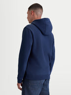 Alpinestars Ageless V3 Hættetrøje, casual sportstøj pullover fleece, blå, set bagfra på model, med foret hætte samt ribmanchetter og ribkant, fremstillet i bomuld og genanvendt polyester.