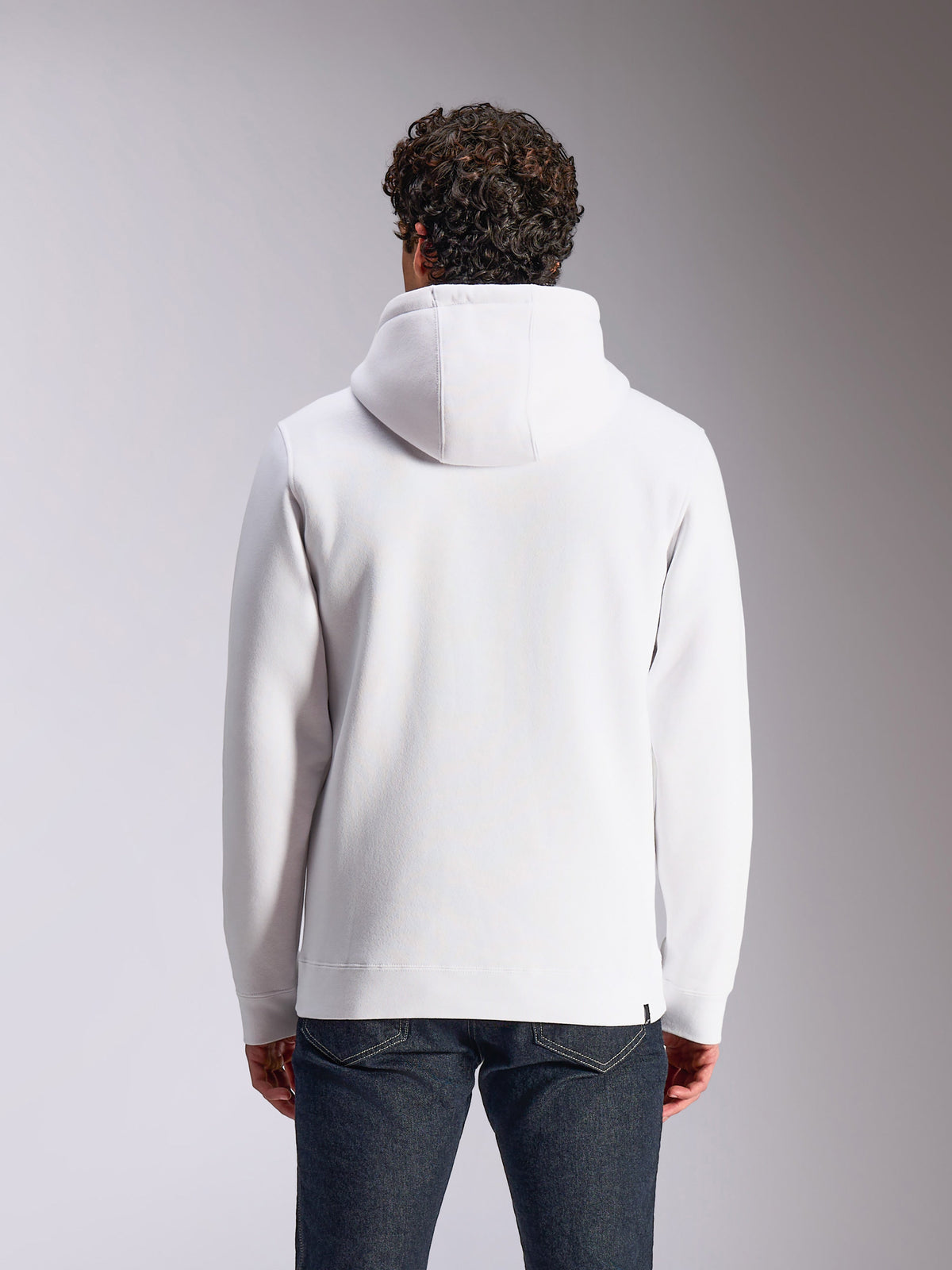 Alpinestars Blaze V3 Hættetrøje, set bagfra, hvid fleece-pullover, hætte med jersey-foer, lange ærmer med ribkanter ved manchetter og søm, afslappet motorsport-inspireret streetwear