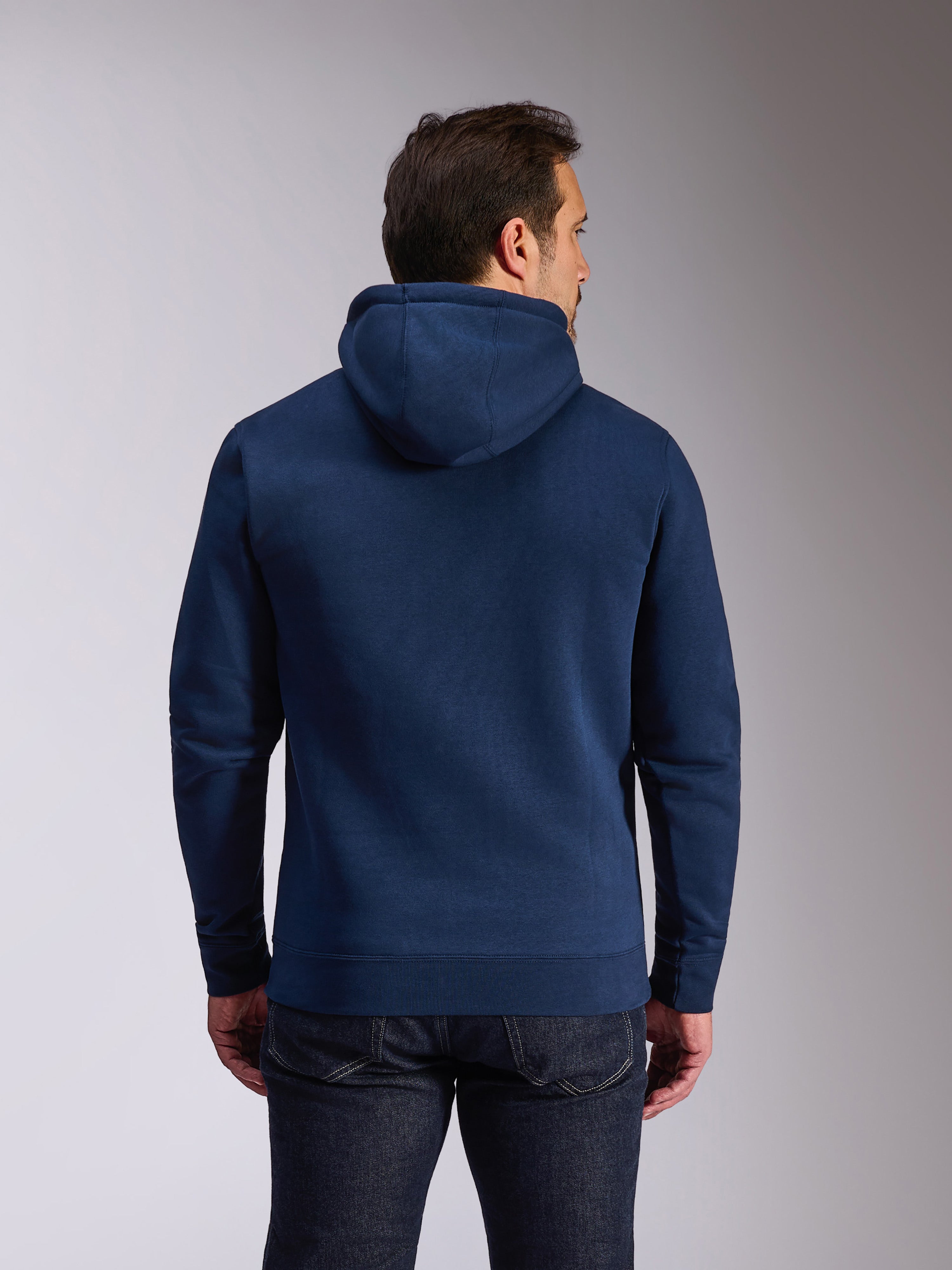 Alpinestars Ride V3 Hoodie, mørkeblå pullover fleece, set bagfra viser ensfarvet blåt design med jersey-foret hætte, ribstrikkede manchetter og kant, afslappet motorsport streetwear