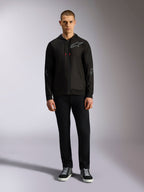 Alpinestars Sessions V3 hættetrøje, fleece-hættetrøje med lynlås foran, sort med gråt Astars-logo på brystet og ærmerne, snoretræk med røde spidser, afslappet motorsport-inspireret streetwear.