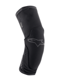 Alpinestars Paragon Plus Knee Protectors, Mountain Bike Knee Protection, Black, ergonomic curved design with breathable stretch mesh, slip-on style, subtle gray Astar logo on the front