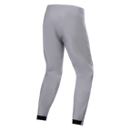 Alpinestars A-Dura Vandtætte Bukser, MTB-bukser, titaniumgrå, set bagfra, med tilspidsede ben og sorte elastiske manchetter, minimalistisk teknisk design til mountainbike