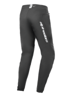 Alpinestars A-Dura Elite bukser, mountainbikebukser, sort, set bagfra med sølvfarvet Alpinestars-logo på låret, lynlåslomme og elastiske manchetter, holdbart teknisk udstyr til MTB
