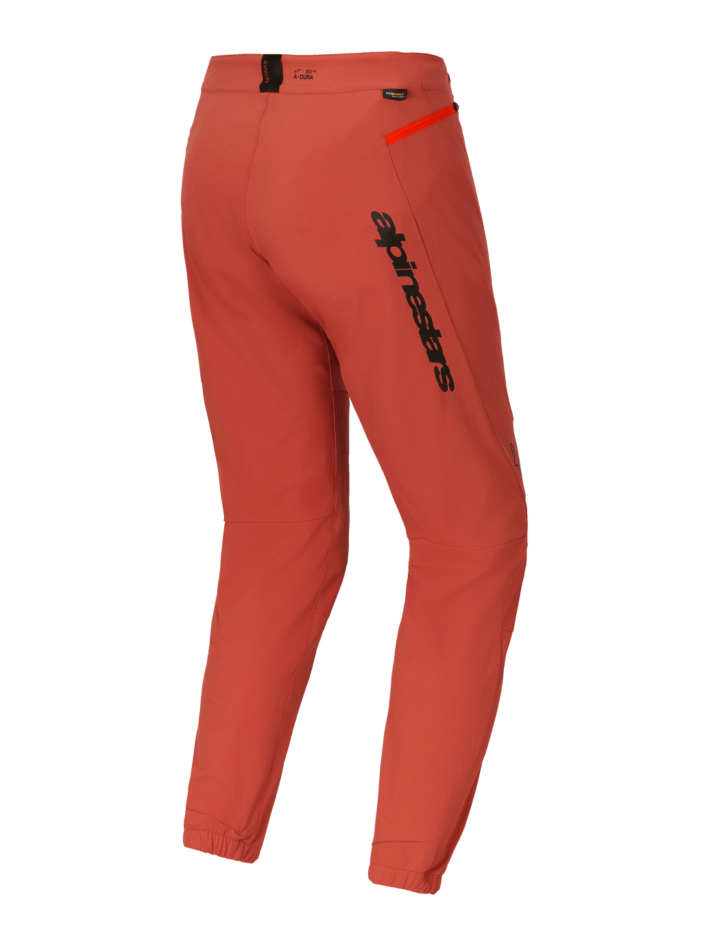 Alpinestars A-Dura Elite bukser, mountainbike (MTB) bukser, mørk orange, set skråt bagfra med markant sort Alpinestars-branding på låret, stærk orange lynlåsdetalje på hoften og elastiske ankelmanchetter, teknisk performance-cykeludstyr