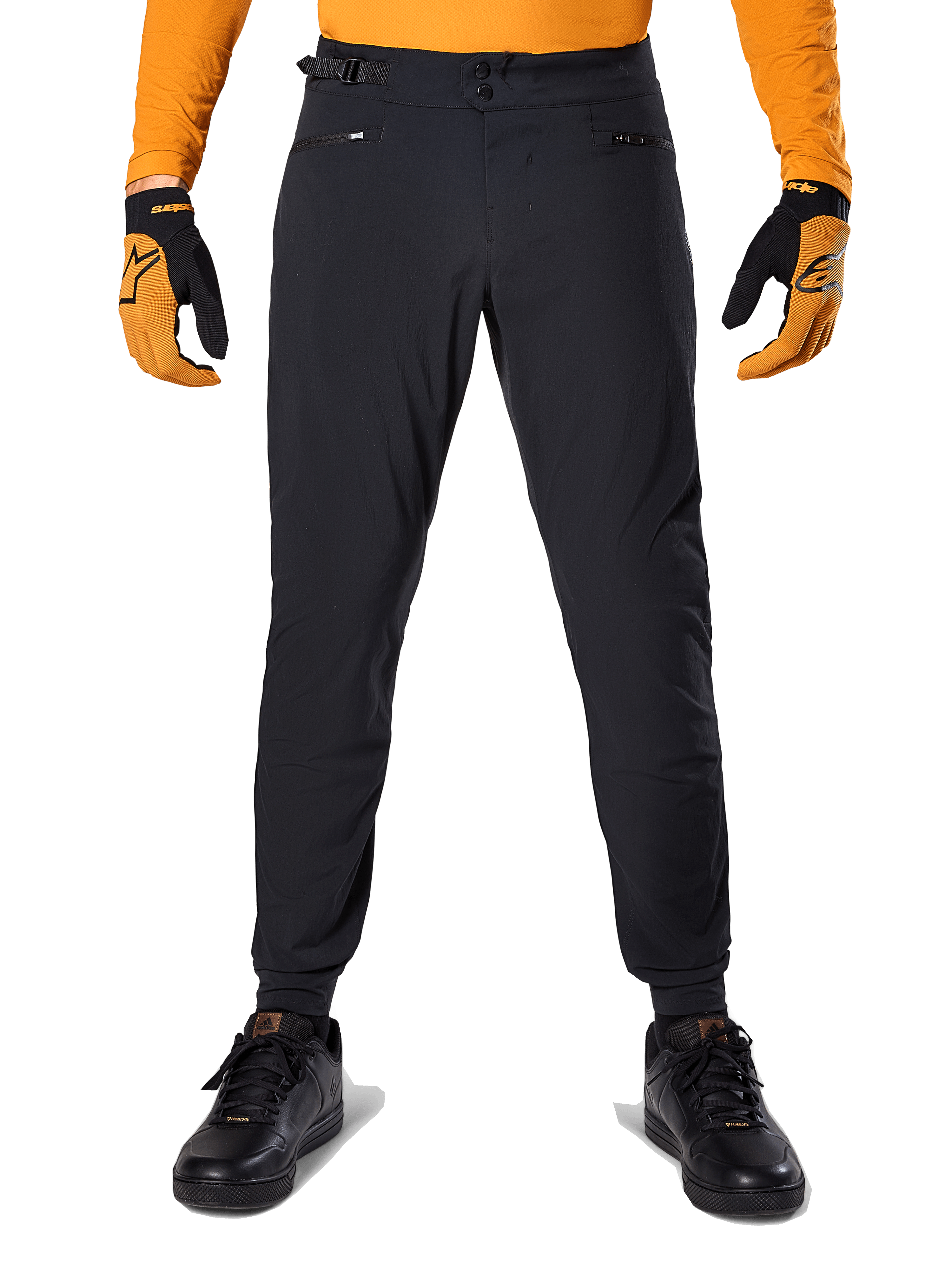 Alpinestars A-Dura bukser, mountainbikebukser, sort, båret med en orange langærmet trøje og sort-orange handsker, med dobbelt snap-lukning og taljejustering i siderne, slidstærkt tekstil til terrænkørsel