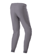 Alpinestars A-Dura bukser, MTB-cykelbukser, mørkegrå, set bagfra i trekvart profil, viser det holdbare 2-vejs strækstof, elastiske manchetter og ergonomisk pasform designet til mountainbike trail performance.