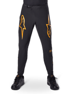 Alpinestars A-Supra Race bukser, MTB cykelbukser, sort med markante orange logoer, med ratchet-taljelukning og laserperforeret ventilation, performance-pasform designet til off-road mountainbike-racing