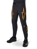 Alpinestars A-Supra Race bukser, sorte med orange stjernegrafik, MTB-racerbukser med laserperforeret ventilation og spænde i taljen, tætsiddende performance-pasform til off-road cykling