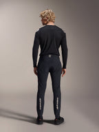 Alpinestars A-Aria Polartec Elite Long Sleeve Jersey, Black MTB Jersey, rear view worn with matching black pants, performance fit for mountain biking, featuring technical moisture-wicking fabric and subtle branding on the lower back