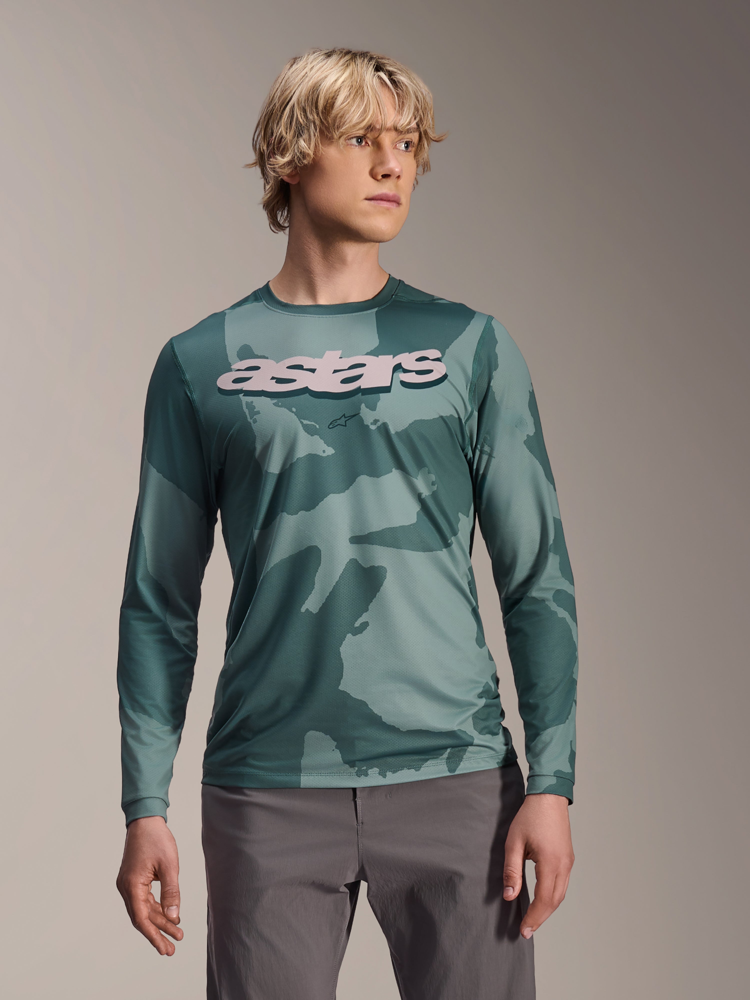 Alpinestars A-Dura Hollow Camo Long Sleeve Jersey, MTB Jersey, Silver Pine Camo green camouflage pattern, large light grey astars logo on chest, worn with grey pants, high-performance mountain biking apparel
