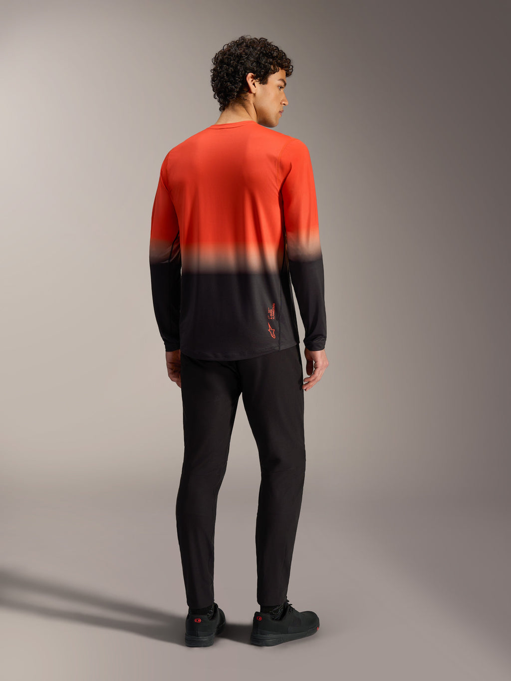 Alpinestars A-Dura ASTARS 2.0 langærmet jersey i orange og sort gradient, mountainbike-trøje set bagfra.
