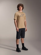 Male model wearing Alpinestars A-Dura Liner Shorts in Black, paired with a tan A-Dura SS Jersey featuring a grey Astars logo, black cycling socks and mountain bike shoes, complete off-road cycling outfit