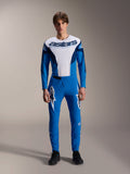 Alpinestars A-Supra Melt bukser, blå MTB-bukser, bæres med matchende hvid og blå langærmet jersey, med hvide stjernelogo-grafikker på lårene, tætsiddende performance-pasform til terræncykling