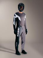 Alpinestars A-Supra Elite MTB-racersæt i Faded Gray med performance-bukser, hvidt tekstlogo og matchende trøje.