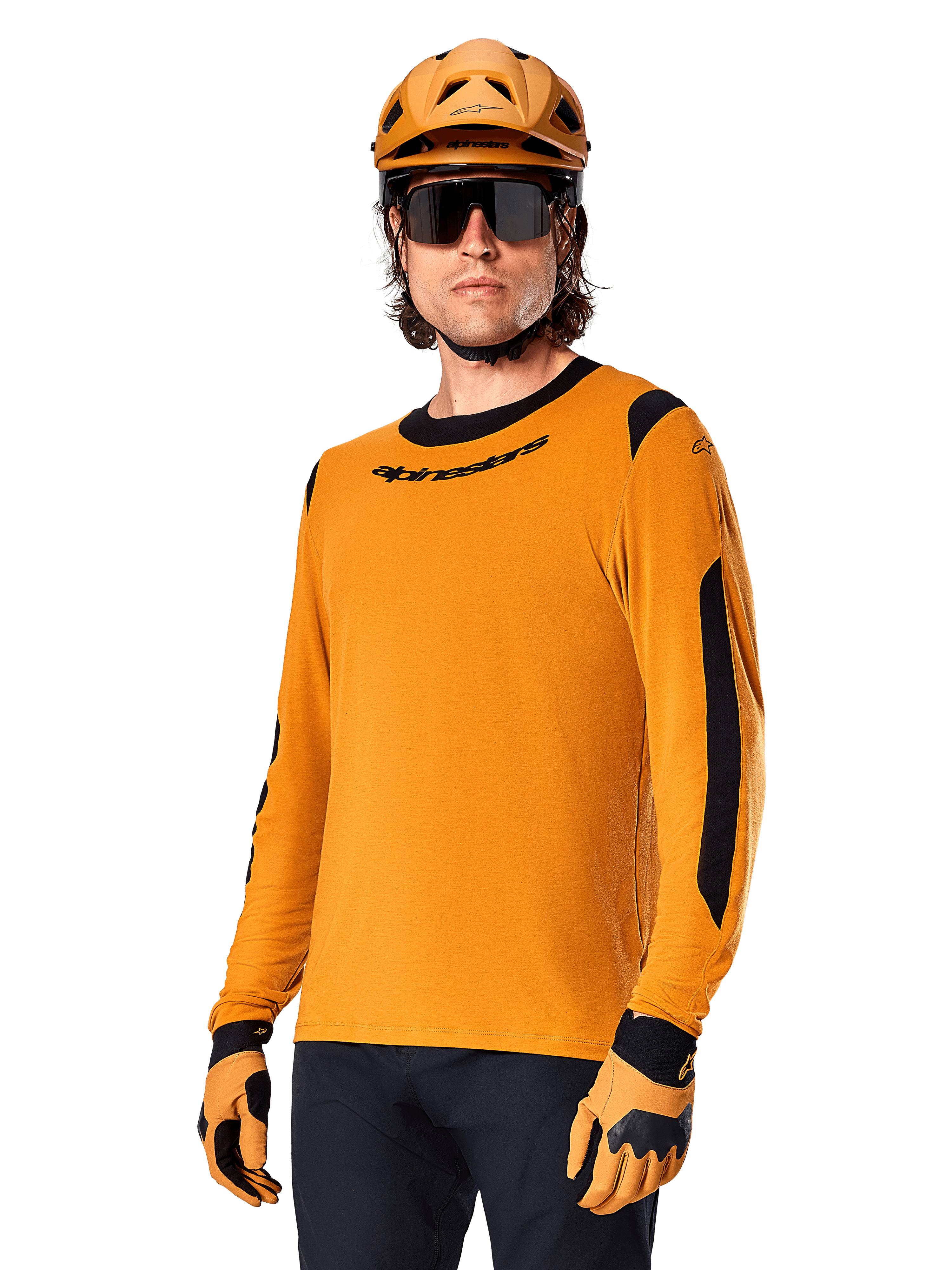 Alpinestars A-Dura Dri Wool Jersey - Long Sleeve, MTB Mountain Biking Jersey, Dark Gold and Black, featuring moisture-wicking merino wool blend and mesh panels, rider wearing matching helmet, sunglasses, and gloves