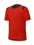 Alpinestars A-Dura Dri Wool kortærmet jersey, Spicy Orange med sorte mesh-paneler på kraven og skuldrene, minimalistisk design med et lille logo på brystet, teknisk mountainbike-beklædning