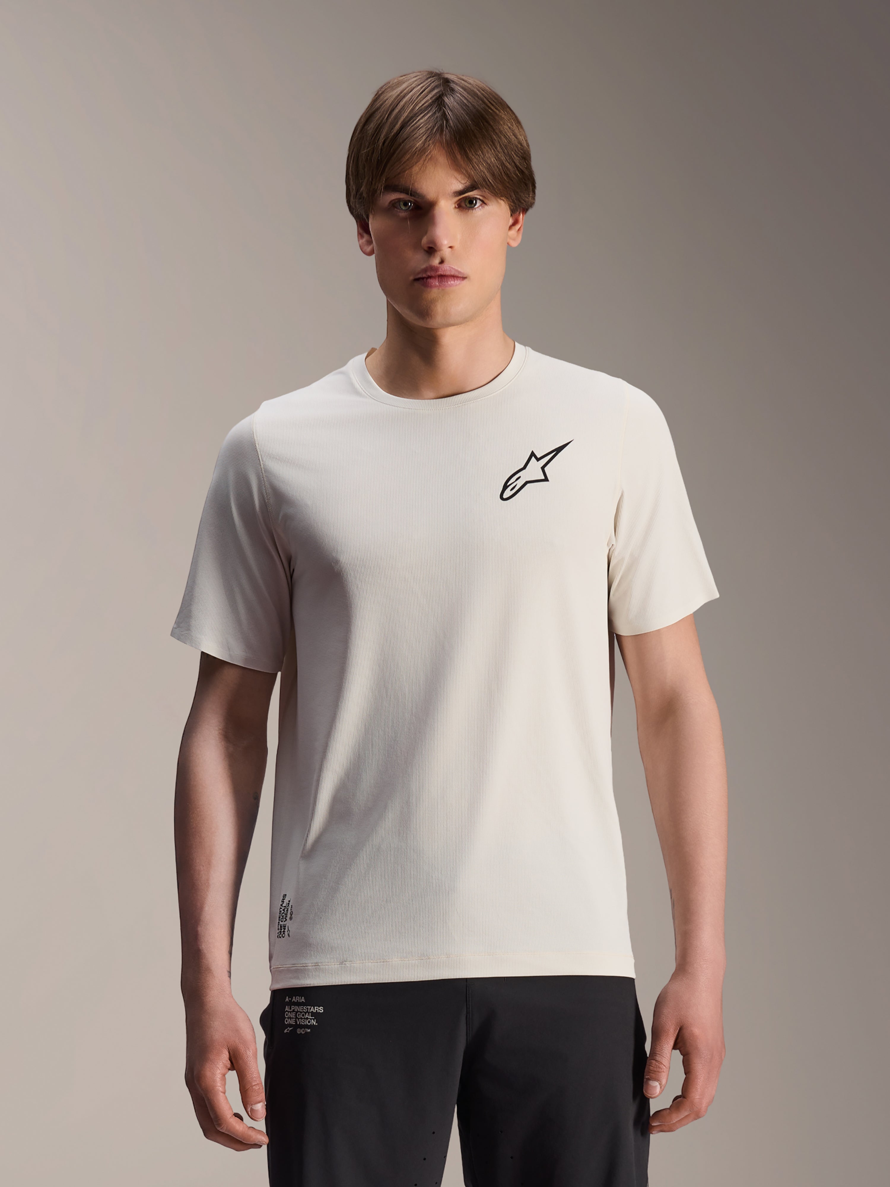 Alpinestars A-Aria Astar trøje, kortærmet cykeltrøje, ecru med sort stjerne-logo på brystet, letvægts åndbar polyester, performance fit til MTB-stikørsel