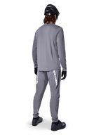 Alpinestars A-Dura Rocker Long Sleeve Jersey, Dark Gray, rear view of model wearing matching gray MTB pants, black helmet, and black gloves, professional mountain bike apparel design