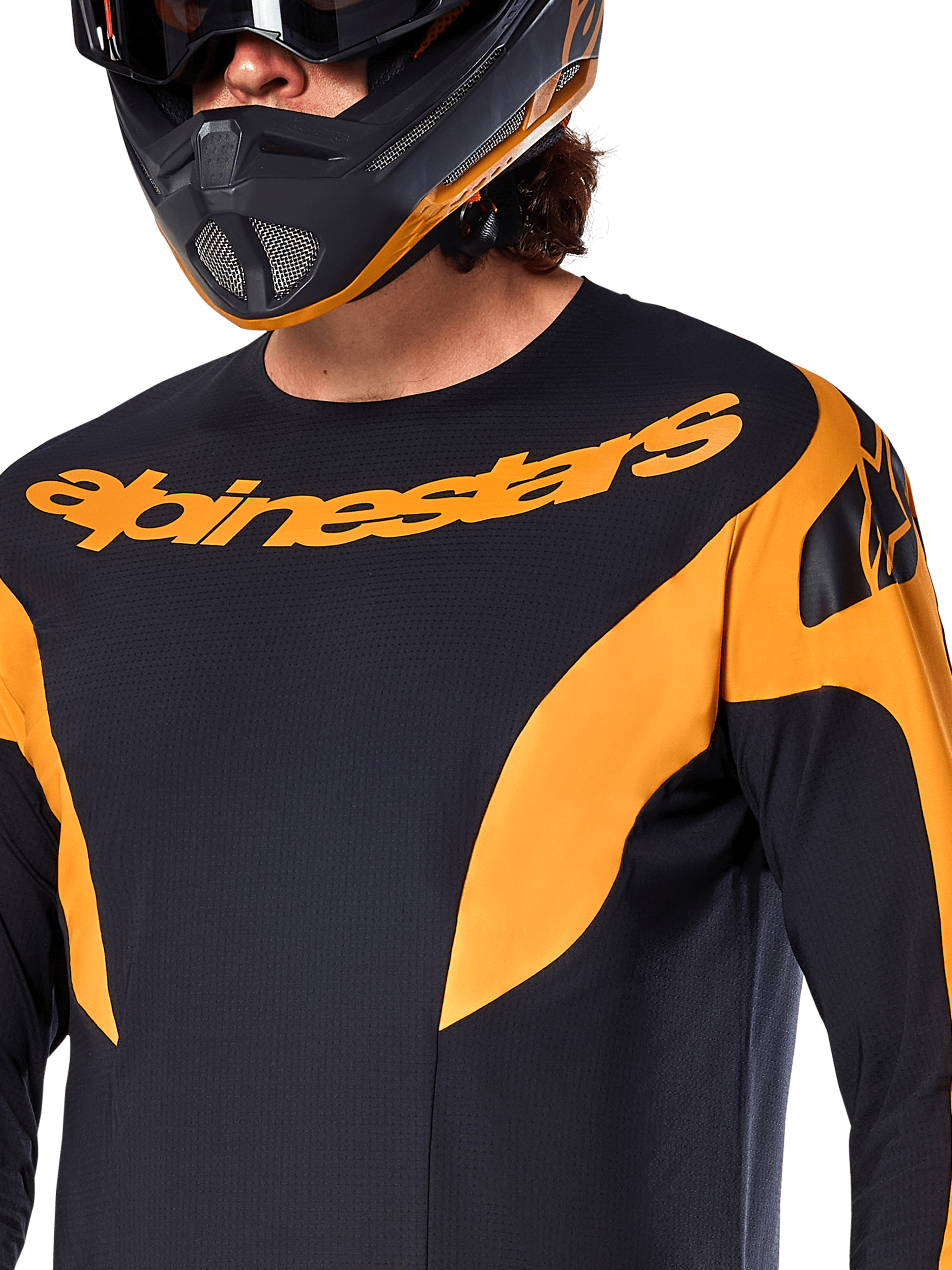 Alpinestars A-Supra Race Jersey - Langærmet, sort med orange grafikpaneler, stort orange Alpinestars-navnetræk på brystet, vist på en rytter iført en matchende sort og orange full-face hjelm, performance MTB-racerbeklædning