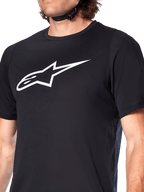Alpinestars A-Dura Dri Oscar Jersey, Short Sleeve MTB Jersey, Black Reflective, featuring a large white Alpinestars logo on the chest, technical moisture-wicking fabric for mountain biking