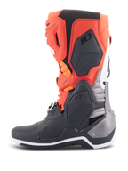 Alpinestars Tech 10 Boots, Motocross Boots, Black Red Fluo and Orange Fluo with White accents, side view showcasing the advanced TPU chassis, buckle system, and ergonomic design for off-road performance.