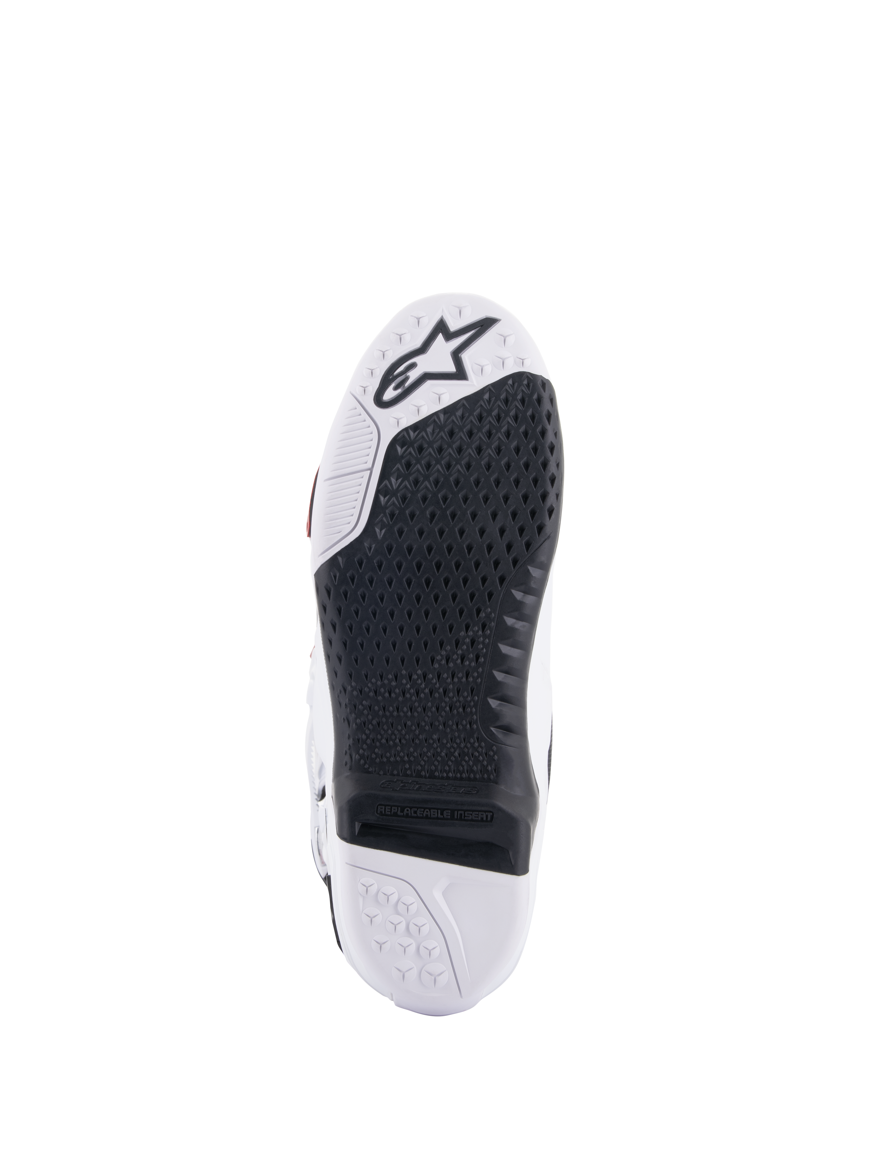 Alpinestars Tech 10 Supervented Boots, White and Black sole view, featuring an extended honeycomb grip design, black replaceable central insert, white toe with Alpinestars star logo, optimized for motocross footpeg control.