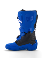 Alpinestars Yamaha Youth Tech 7S støvler, motocross-støvler til unge, blå med sorte og hvide accenter, set fra siden, med præget 'Tech Series'-branding, TPU-beskyttelsespaneler, spændelukkesystem og en slidstærk blå sål til off-road performance