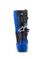 Alpinestars Yamaha Youth Tech 7S støvler, motocross-støvler, blå, sort og hvid, set bagfra der fremhæver TPU-hæl- og lægbeskyttelse, hvidt stjernelogo og holdbart pivotsystem-design