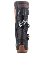 Alpinestars Tech 7 Enduro Boots, Black and Dark Brown, rear view showing the Achilles accordion flex zones and TPU protection, features white Alpinestars star logo and tan heel detailing, rugged design for Enduro and off-road riding.