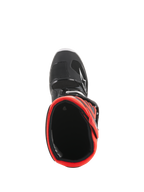 Alpinestars Youth Tech 7S Boots, Motocross Boots, Black and Fluorescent Red, top-down view looking into the red inner lining, featuring a black outer shell with white star logo and durable synthetic construction
