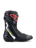Alpinestars Supertech R Boots, high-performance motorcycle racing boots in black with white, red fluo, and yellow fluo accents, featuring a protective TPU shin plate with a red logo, replaceable toe slider, and sleek aerodynamic profile.