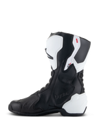 Alpinestars Stella SMX-6 V3 Drystar® støvler, performance-kørestøvler til kvinder, hvid og sort, set fra indersiden med præget Drystar-branding, hvid TPU-skinnebens- og hælbeskyttelse og strømlinet sort mikrofiber-overdel til kørsel på bane og vej.