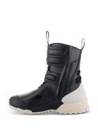 Alpinestars Women Stella RT-7 Touring Drystar® Boots, Black and White, lateral profile of a tall touring motorcycle boot featuring microfiber construction, side zipper with adjustable straps, and a contrasting off-white heel and sole.
