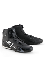 Alpinestars Celer Shoes, Motorcycle Riding Shoes, Black and White, featuring the Rotor Closure System dial, large white Astar logo on the side, sleek technical microfiber construction for sport street performance